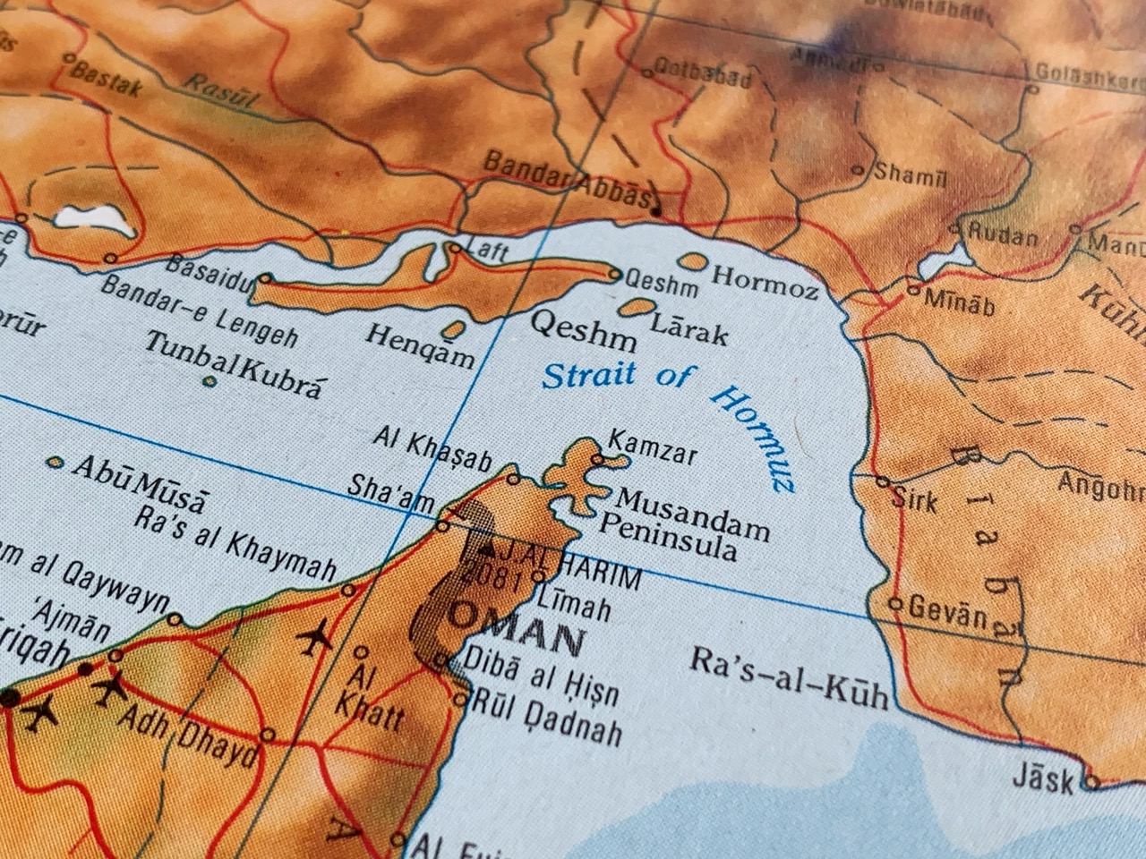 Close-up of a map showing the Strait of Hormuz between Oman and Iran